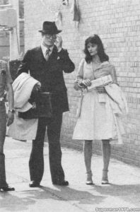 SUPERMAN THE MOVIE- Christopher Reeve as Clark Kent and Margot Kidder as Lois Lane filming the mugger sidewalk scenes. July 8, 1977. New York, U.S. Director- Richard Donner