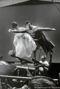 SUPERMAN THE MOVIE- Christopher Reeve as Superman and Margot Kidder as Lois Lane film the flight over Metropolis and Can You Read My Mind sequences. January 27, 1978. Pinewood Studios.